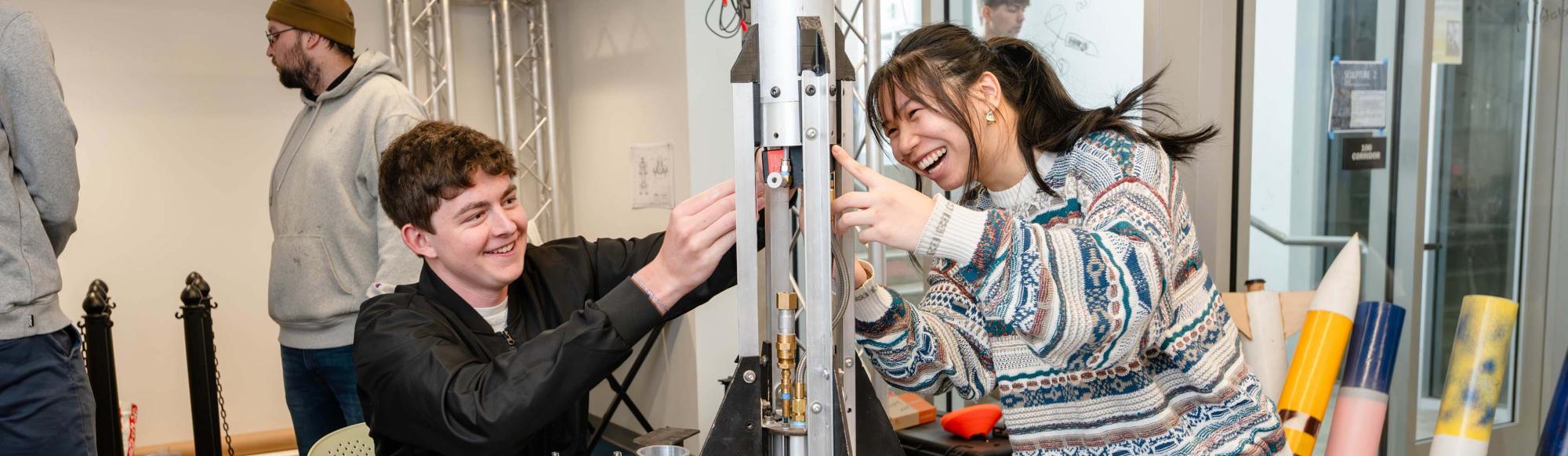 Two students working in a lab
