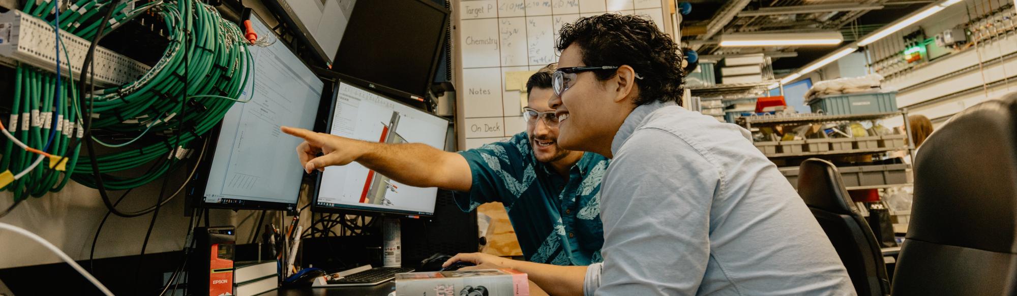 Two students working a project