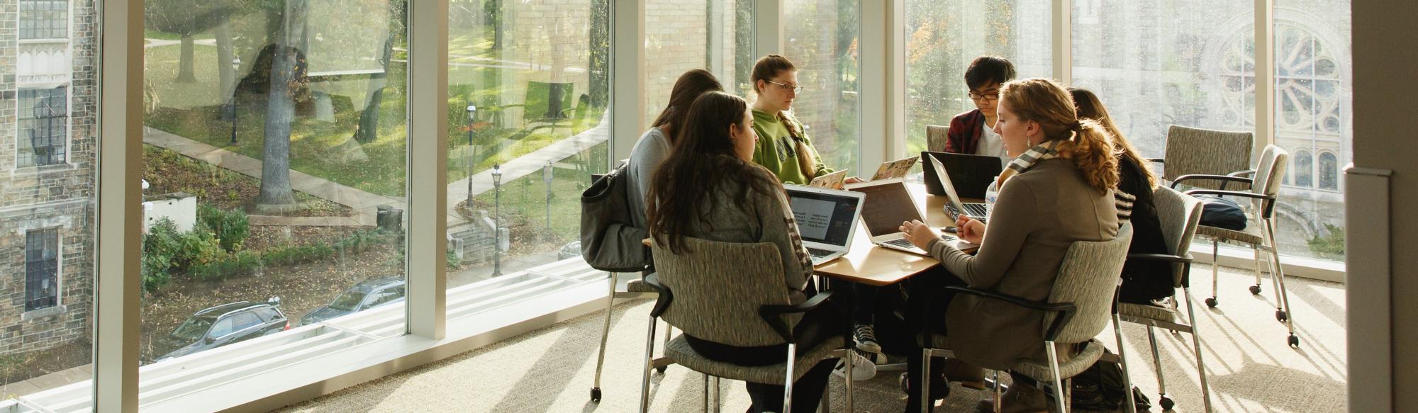 People sitting at a conference table having a meeting