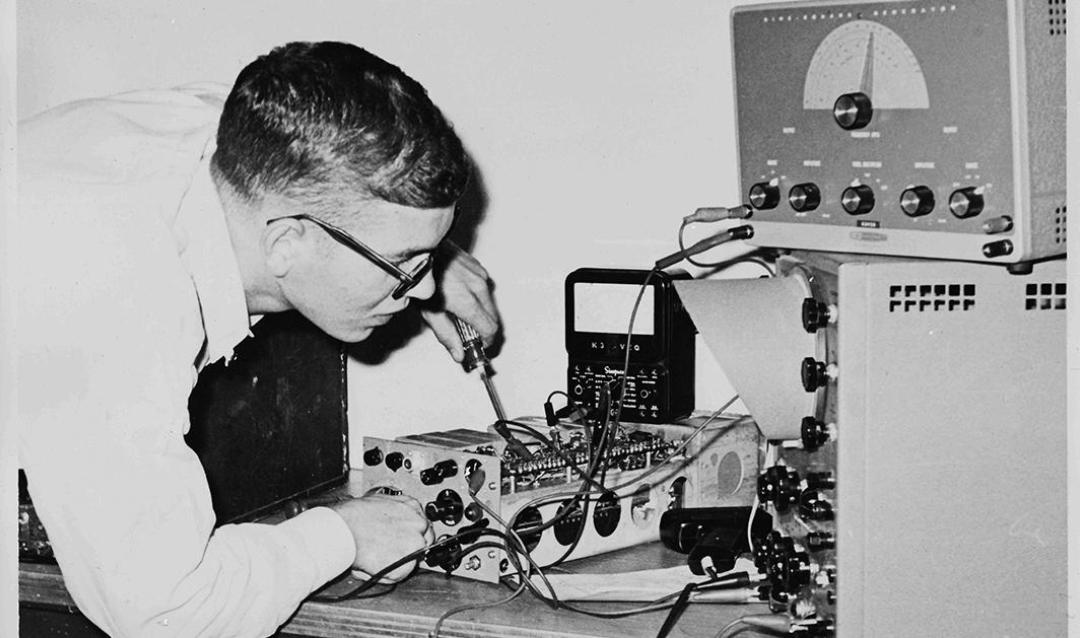 student working on a ham radio