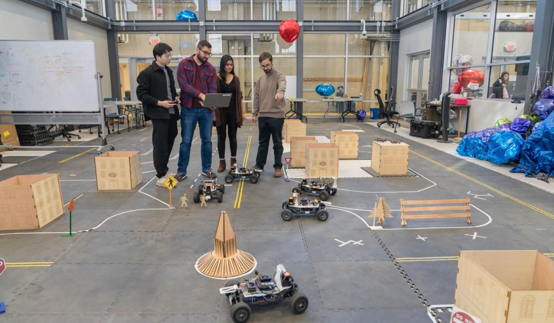 Students testing self-driving model car