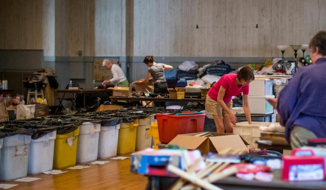 Volunteers and sorting bins