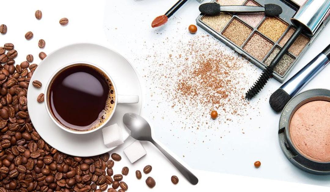 Cup of coffee next to cosmetics