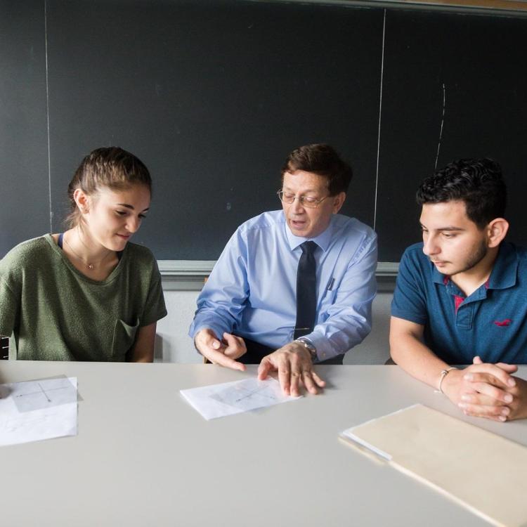 Students sitting at a conference table