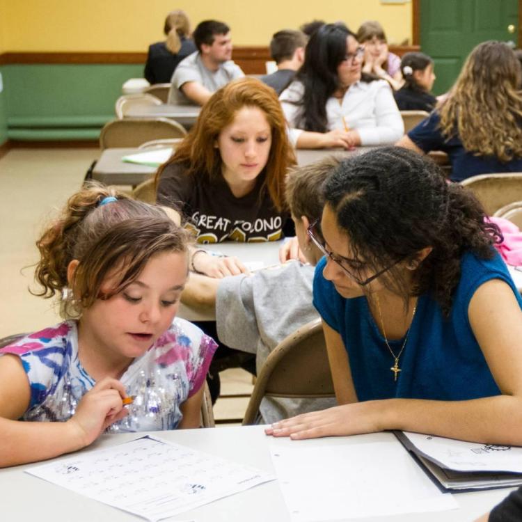 Small child being tutored