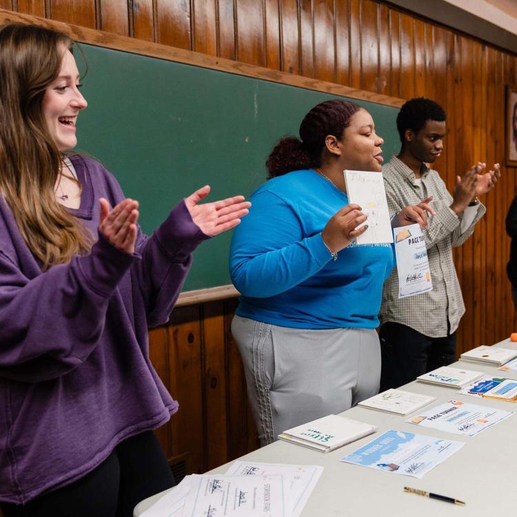 Three women participating in a community event