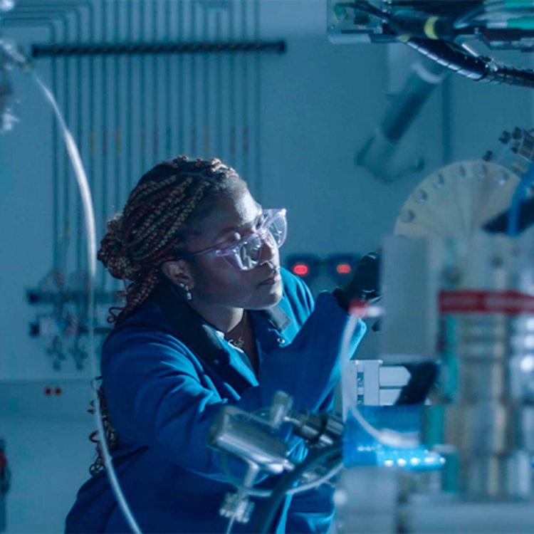 A woman working on an experiment in a lab