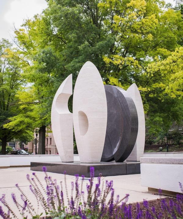 Outdoor sculpture with trees in the background