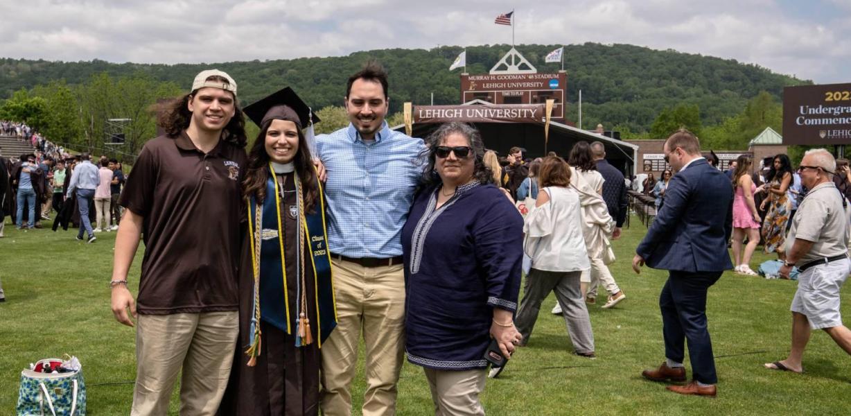 Family posing for a photo during Commencement