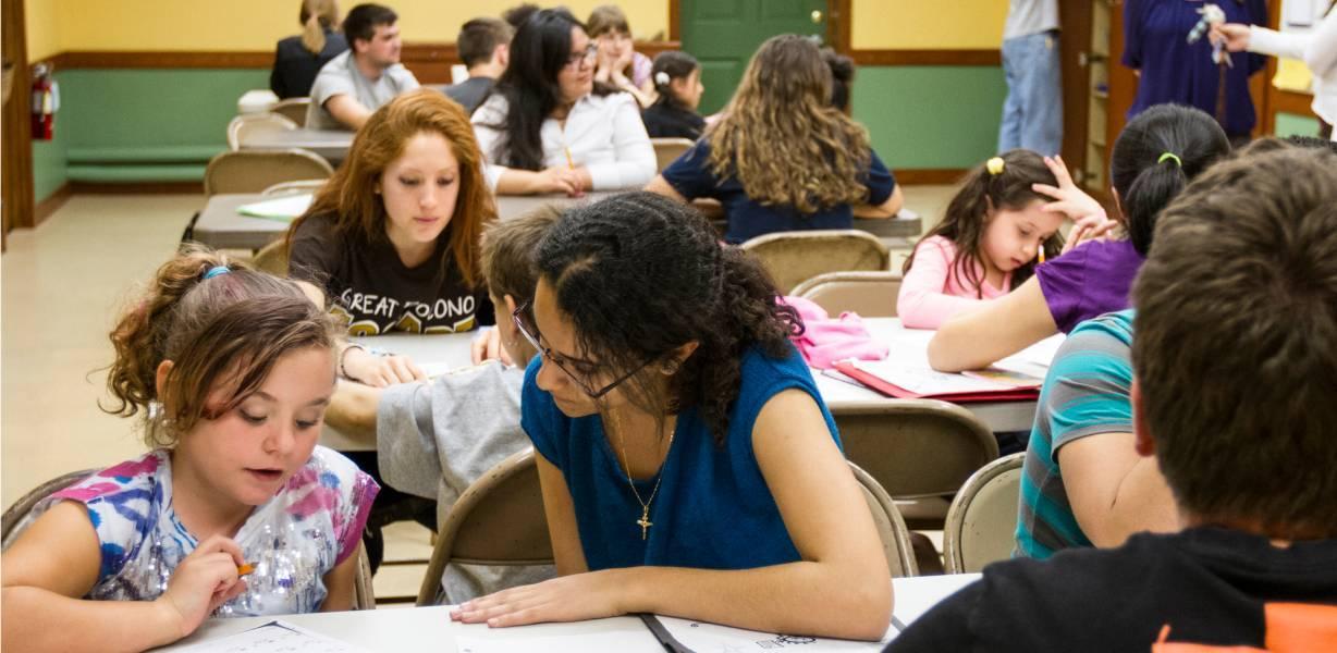 Young child being tutored after school