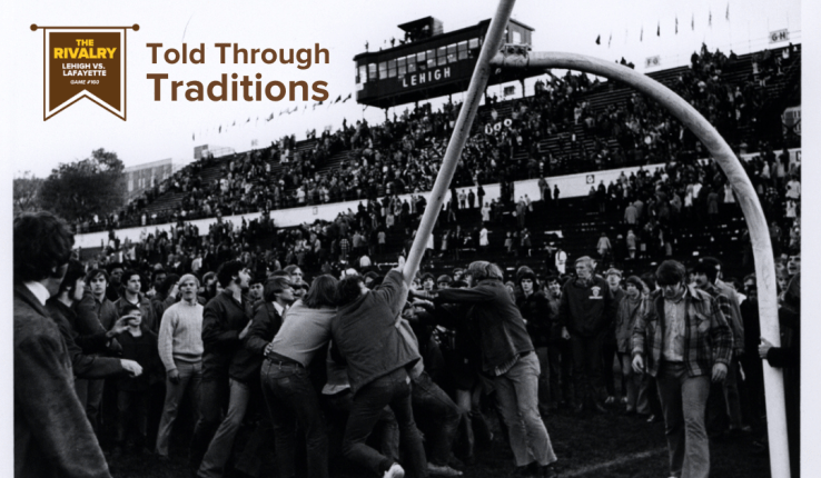 Black and white photo of people tearing down a goalpost