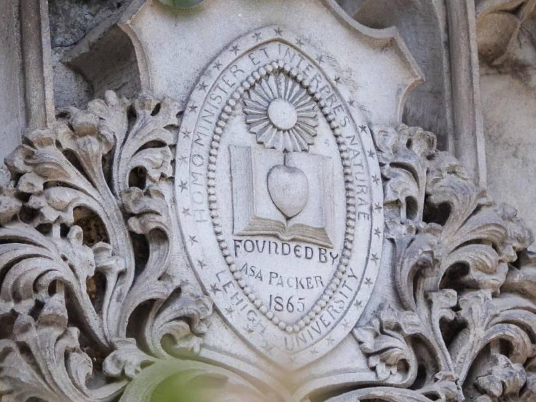 Stone Lehigh University seal on a building exterior