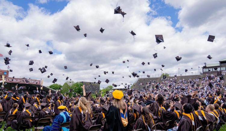 Lehigh University graduates toss their mortarboards in celebration